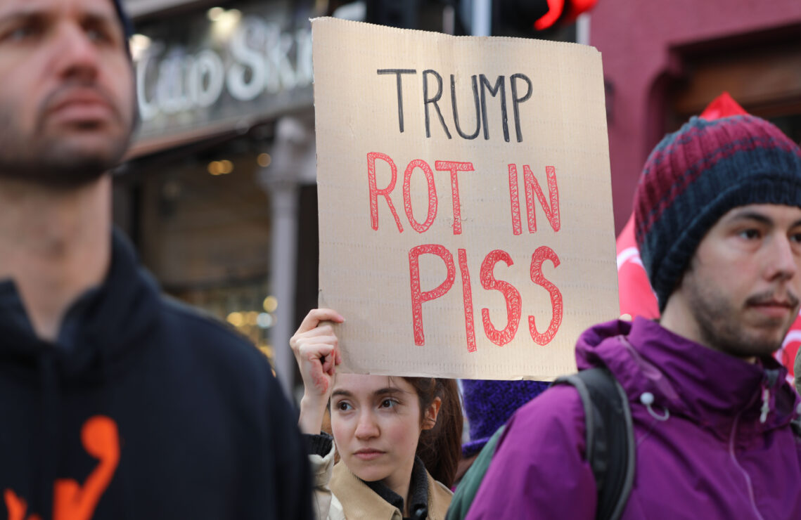 Anti Trump banner at IWD march in Edinburgh 2025